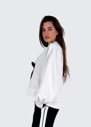 Felpa scollo a V con spilla