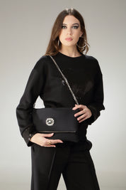 Pochette elegante con gioiello